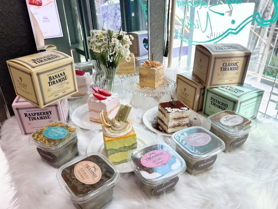 A display case with various kinds of tiramisu