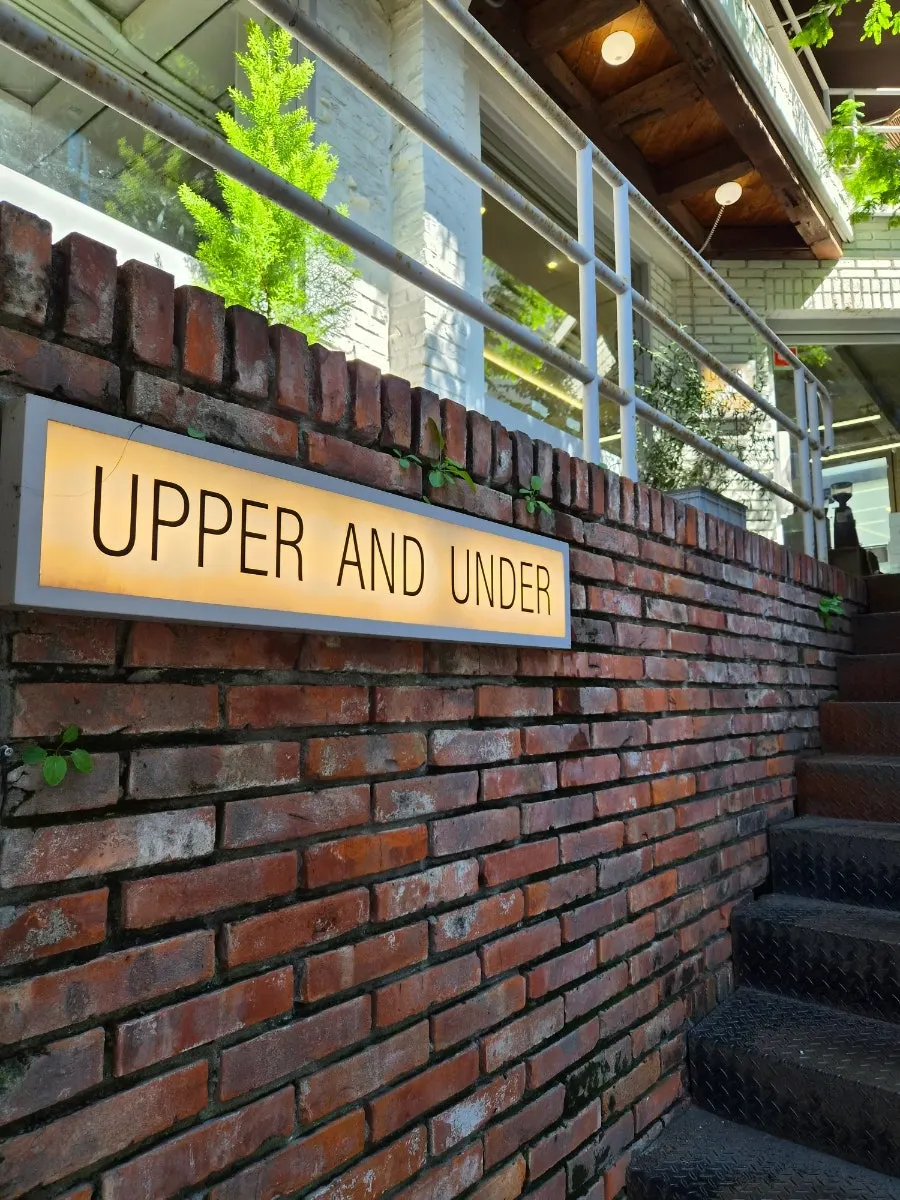 Upper and Under building with brick and glass windows