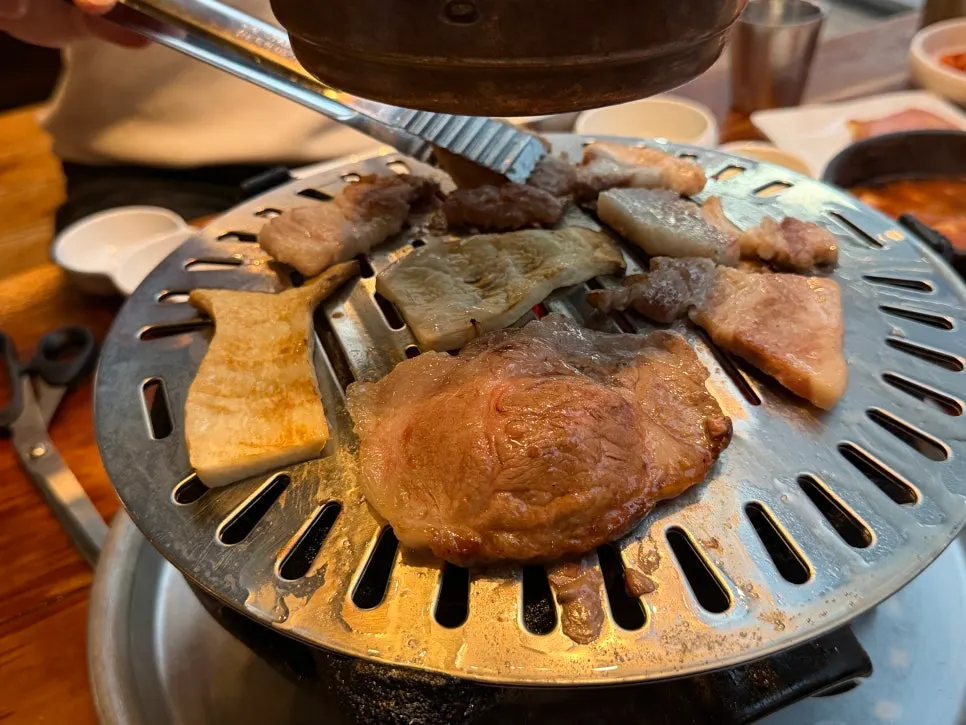 Pork belly and neck cooking on the charcoal grill