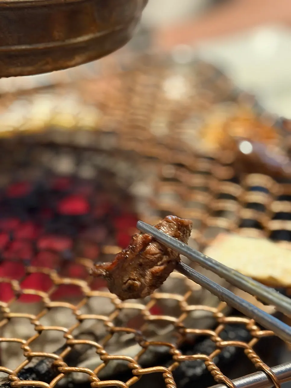Close-up of meat on the charcoal grill