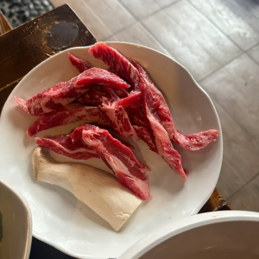Pork belly served with mushrooms