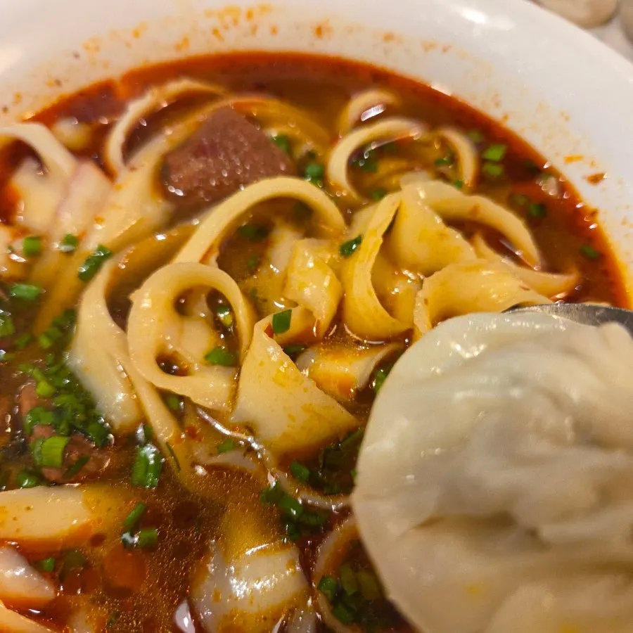 Beef dosakmyeon and xiaolongbao served together