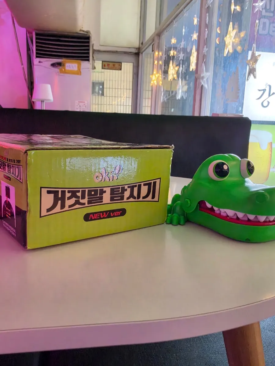 Lie detector and crocodile game set on the table