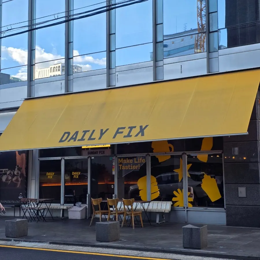 Exterior of Daily Fix Gangnam Main Branch with its yellow awning