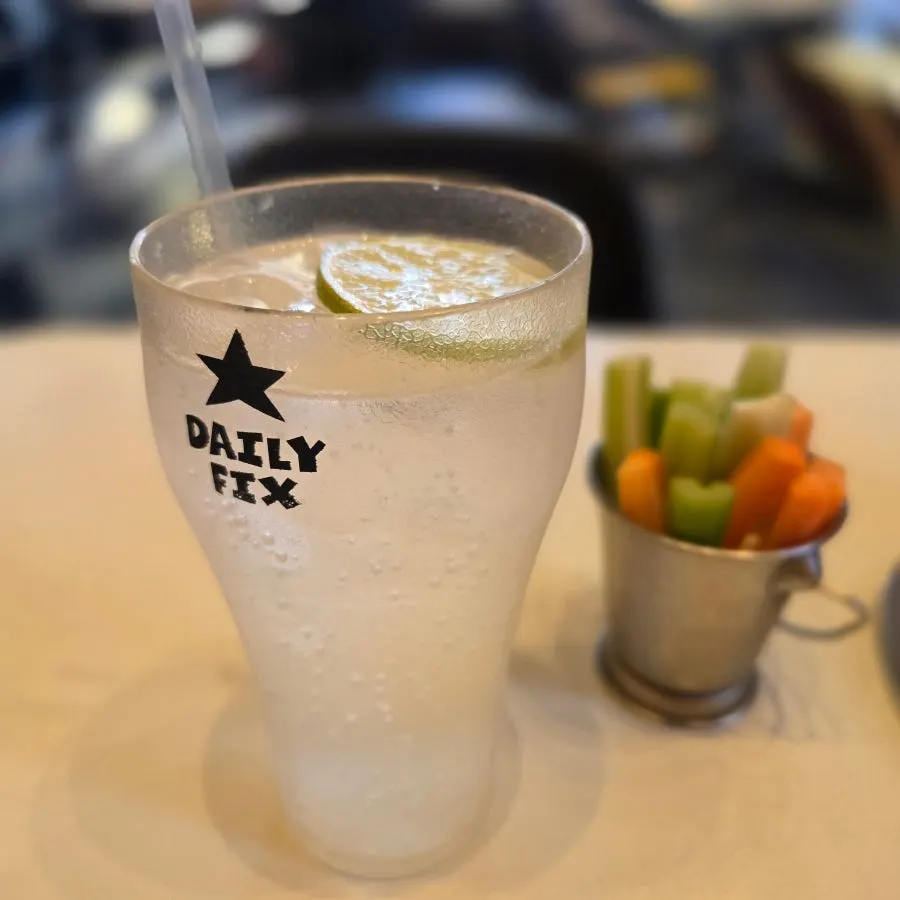 Glass of soda water with a slice of lime