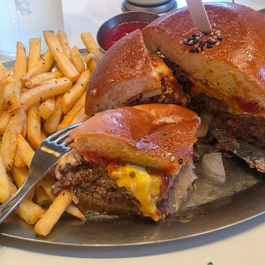 Close-up of the burger showing cheese and onion