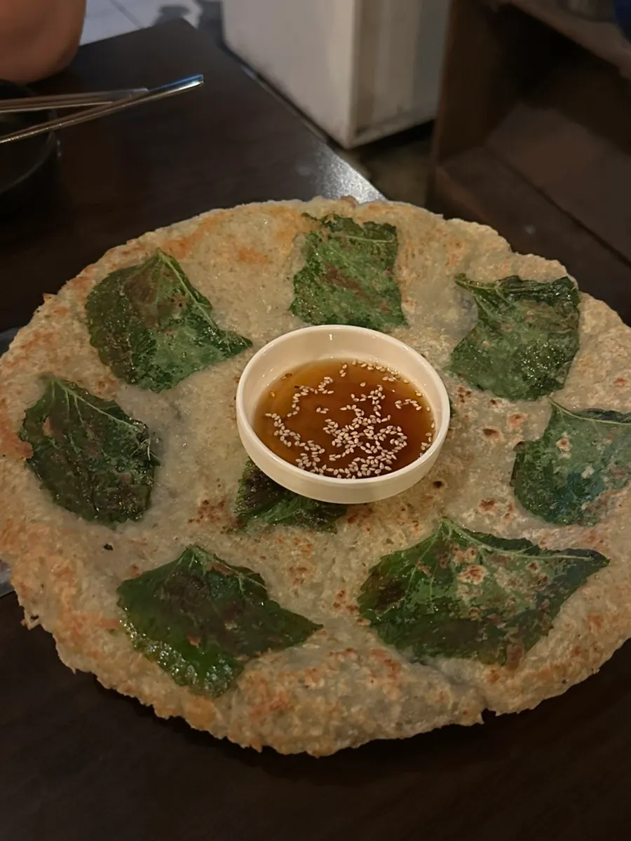 A freshly made plate of perilla leaf potato pancake