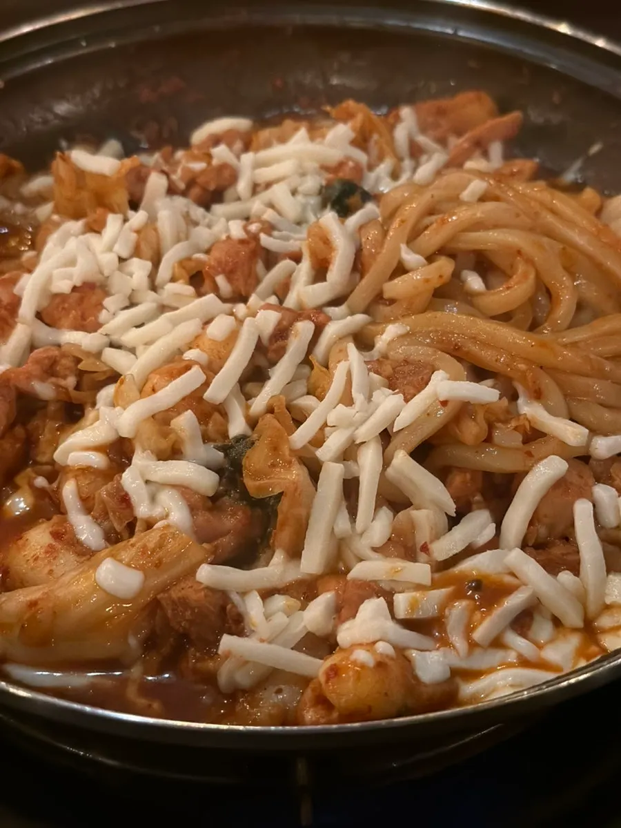 Gamssachidak on the griddle with cheese starting to melt