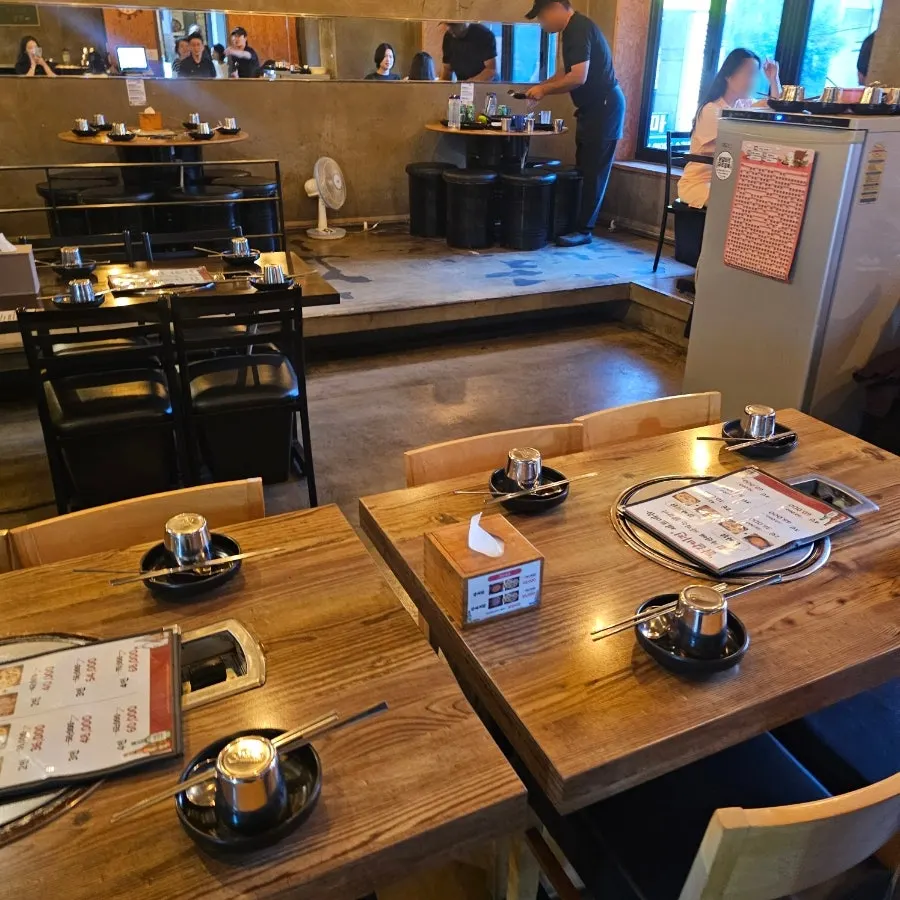 Interior of Dakgalbijeon Gangnam Branch with tables spaced out comfortably