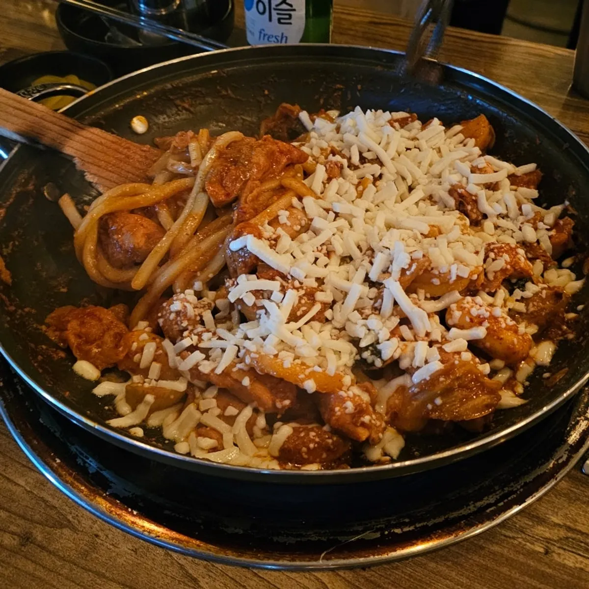 Close-up of dakgalbi fully coated in seasoning