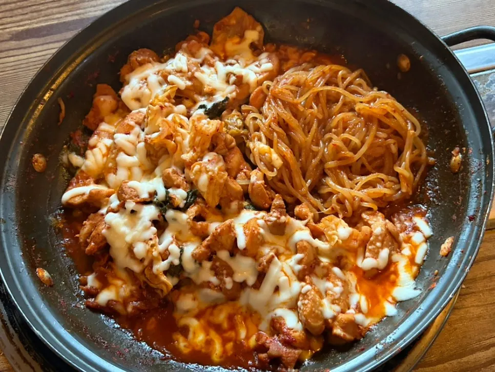 Cheese dakgalbi served fully cooked on the hot plate