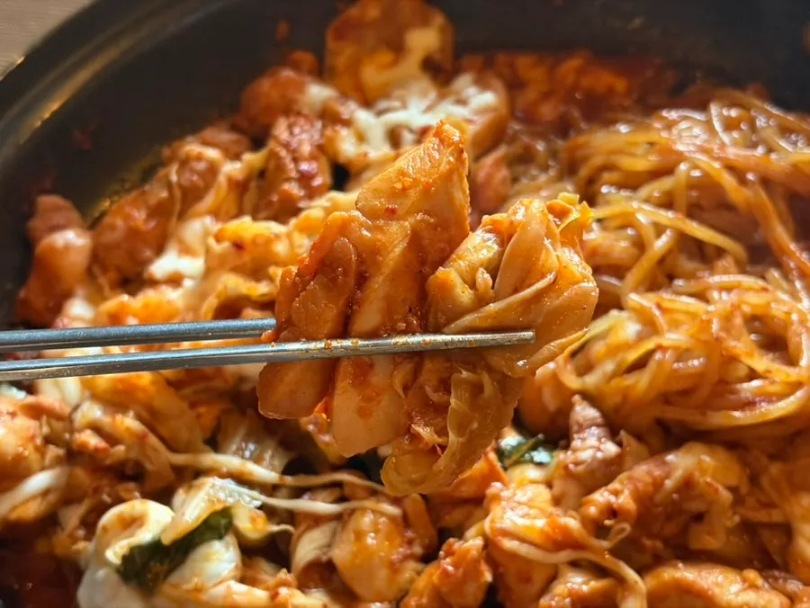 Hot plate with dakgalbi sauce and vegetables mixed together