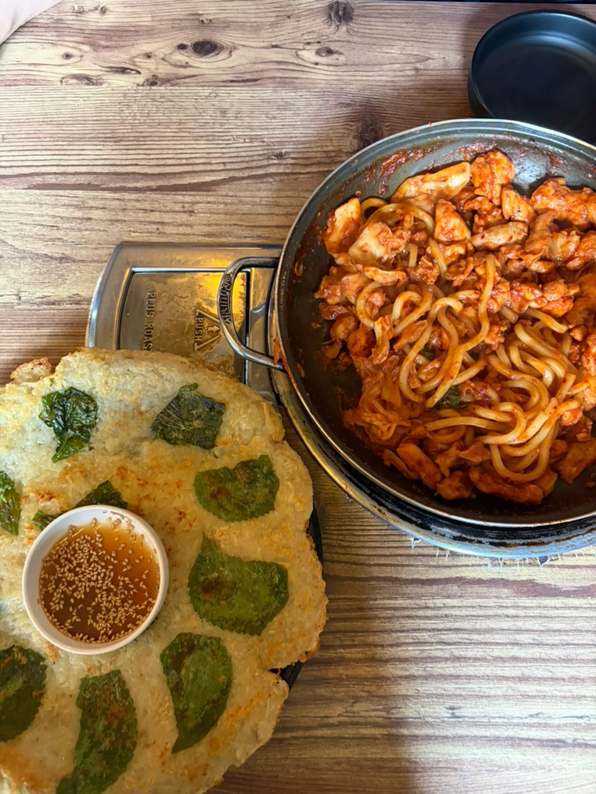 The finished gamssadak set for two, fully stir-fried dakgalbi