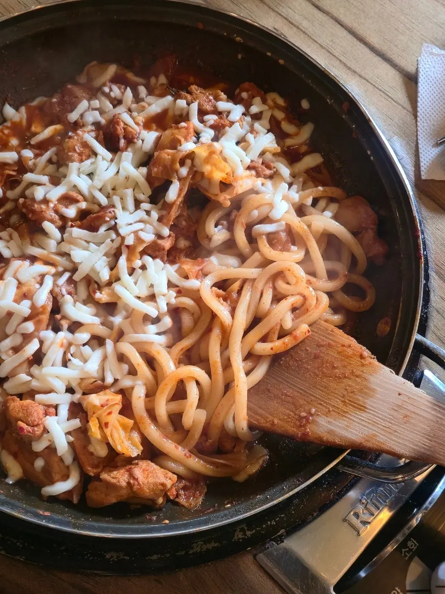 Udon noodles wrapped in melted cheese