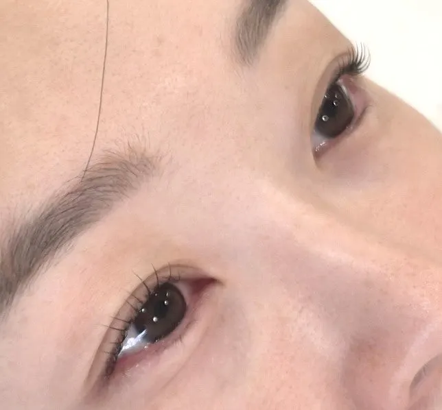Close-up of clearer lash color after the nutrition + tint lift