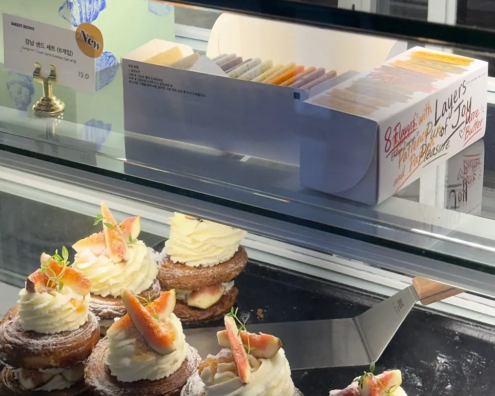 Display case lined with pastries and salt bread