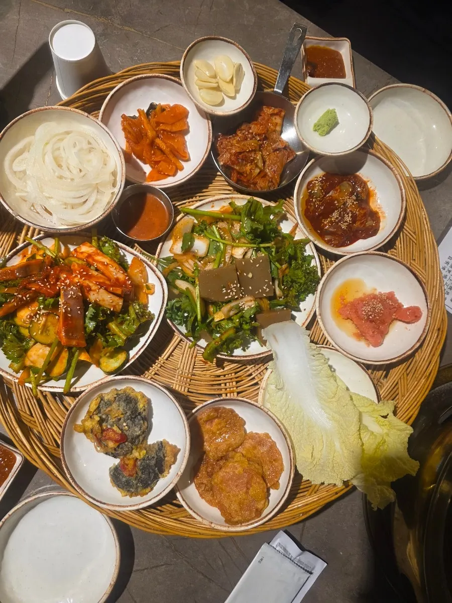Fresh ssam vegetables and pickles set out on the table
