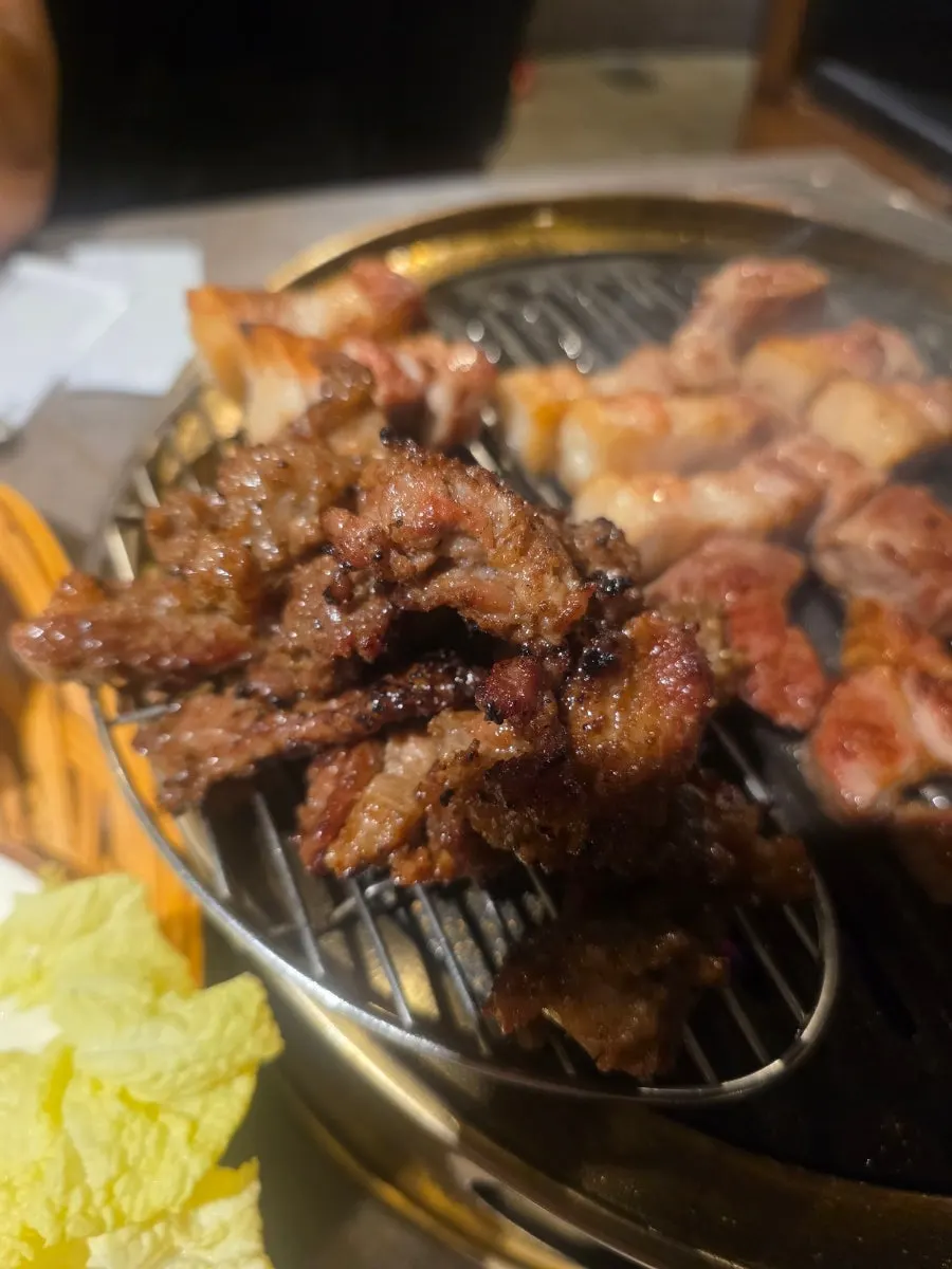 Seasoned oddol galbi being rolled on the grill