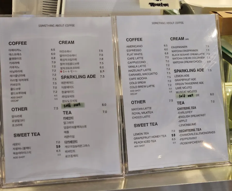 Coffee and latte menu board at Something About Coffee