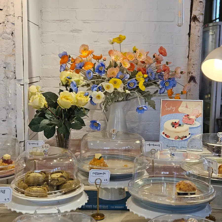 Cake display case being restocked
