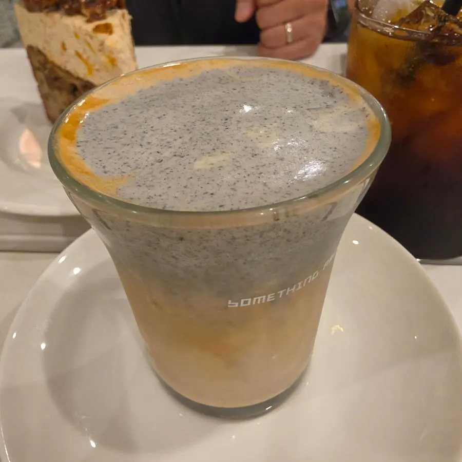 Black sesame cream latte with visible black sesame layer