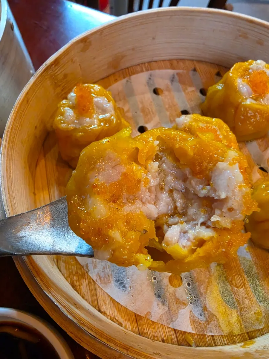 Cross-section of shaomai showing the plump shrimp