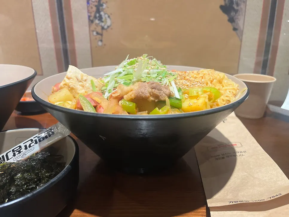 Mixed doenjang jjageuli with beef brisket, sausage ingredients, and king dumplings