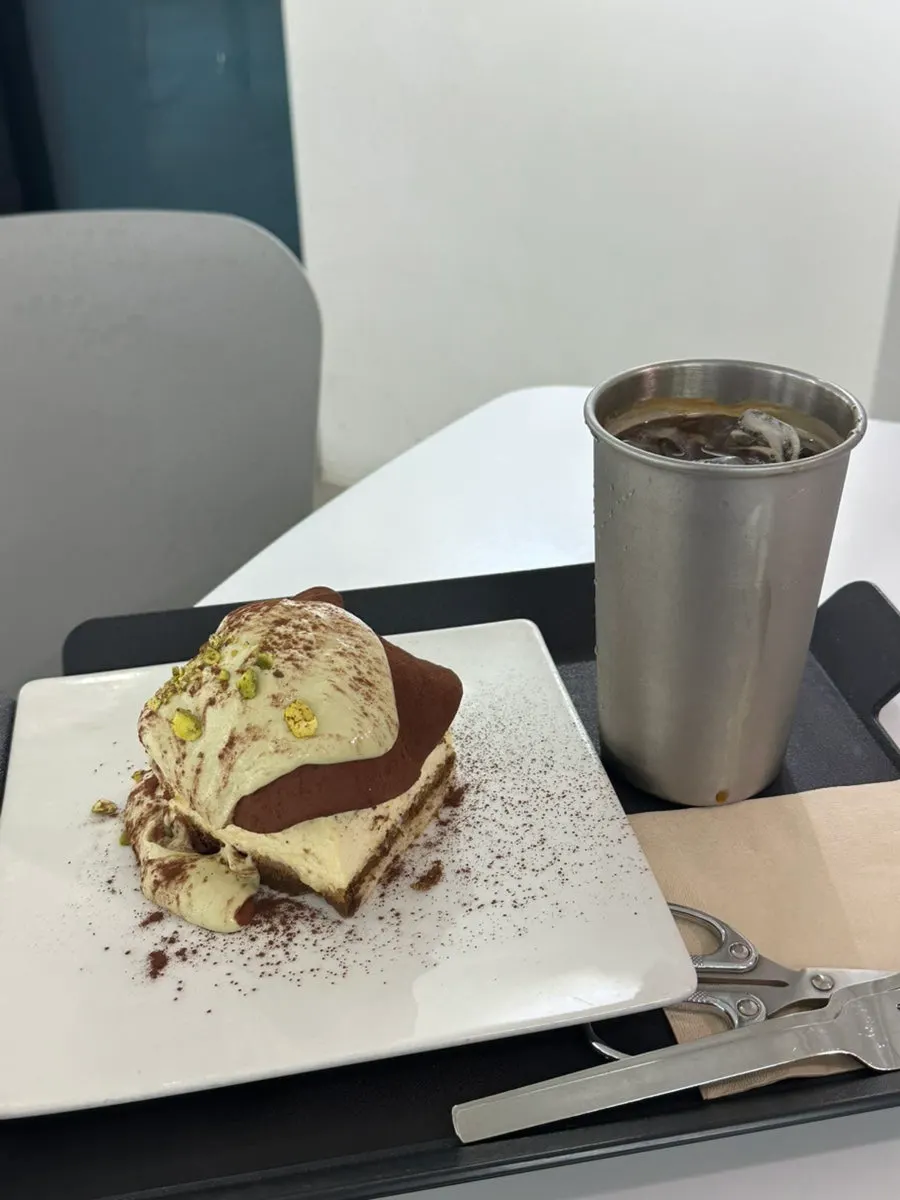 Dubai chewy tiramisu with iced americano and scissors