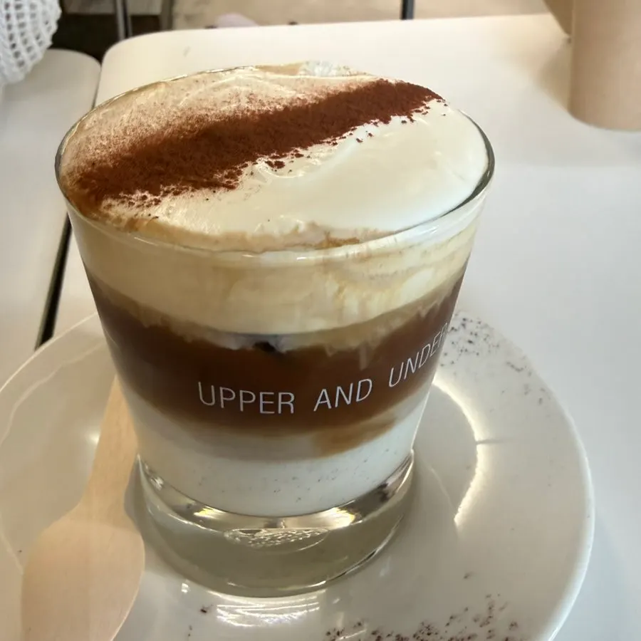 A cup of Einspänner topped with cream