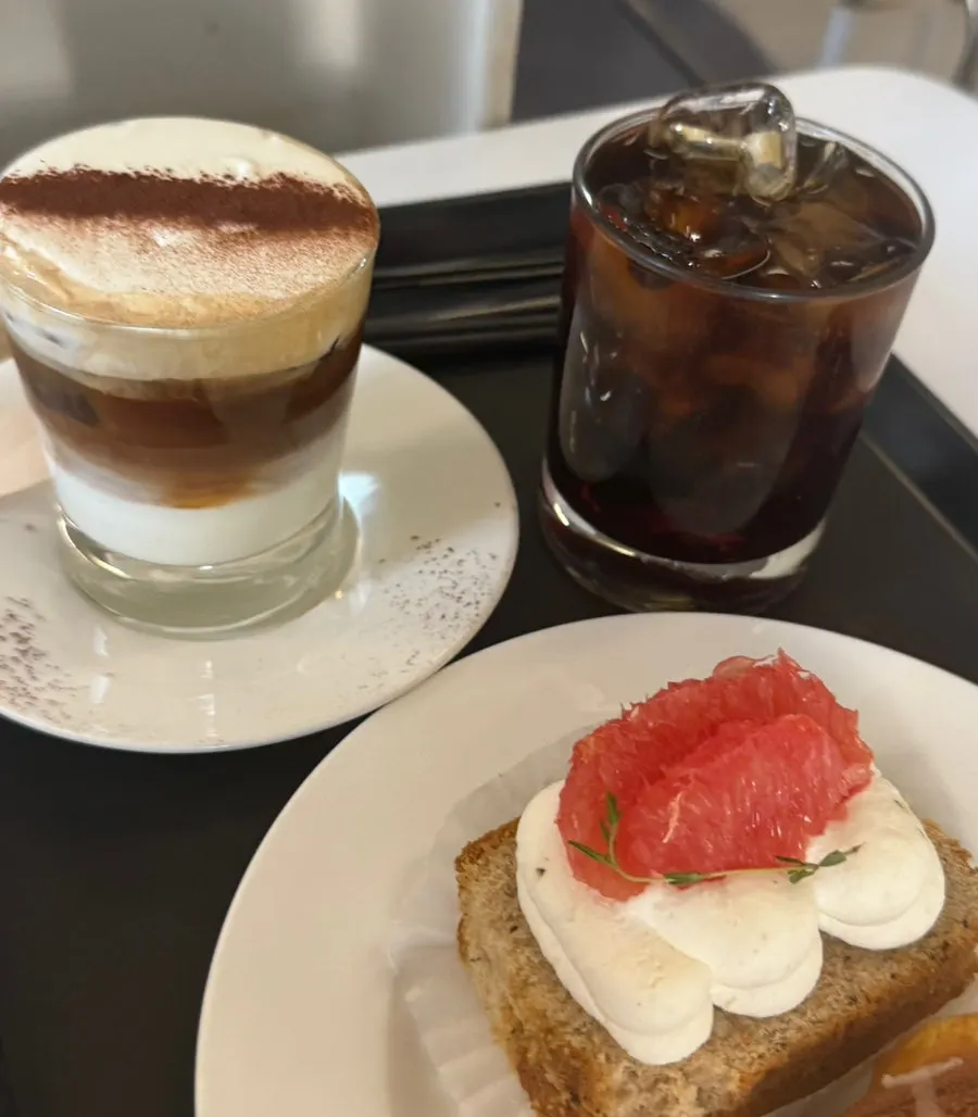 Two coffees and desserts on the table