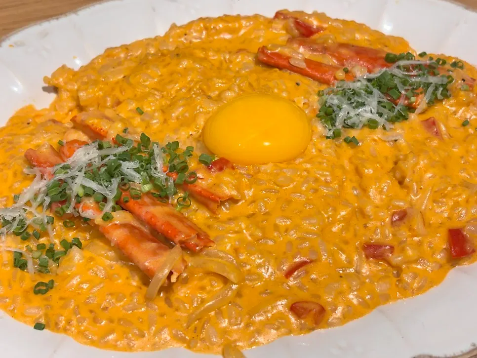Thick spicy crab risotto topped with crab leg
