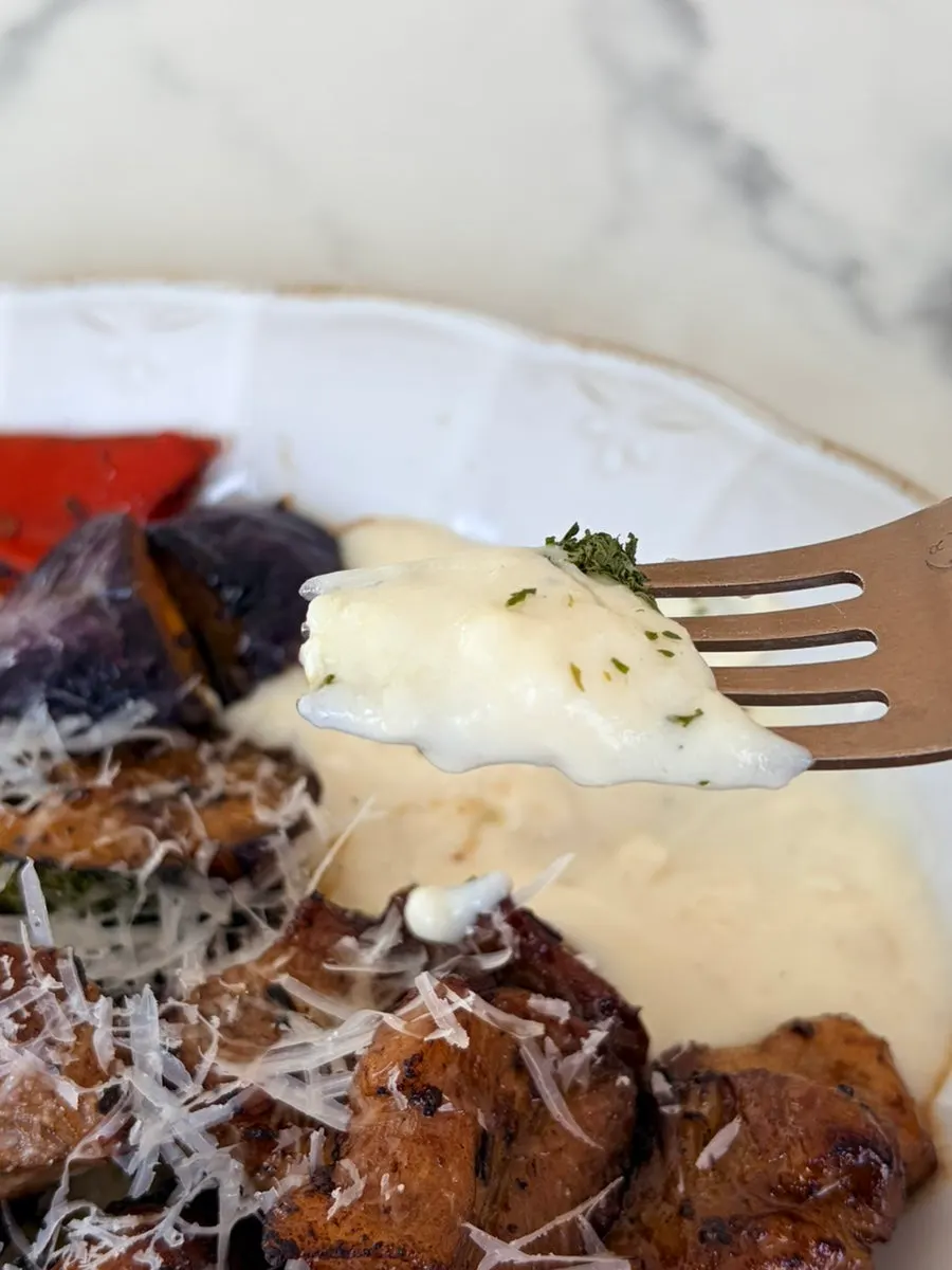 Signature pork neck steak topped with a snowfall of cheese