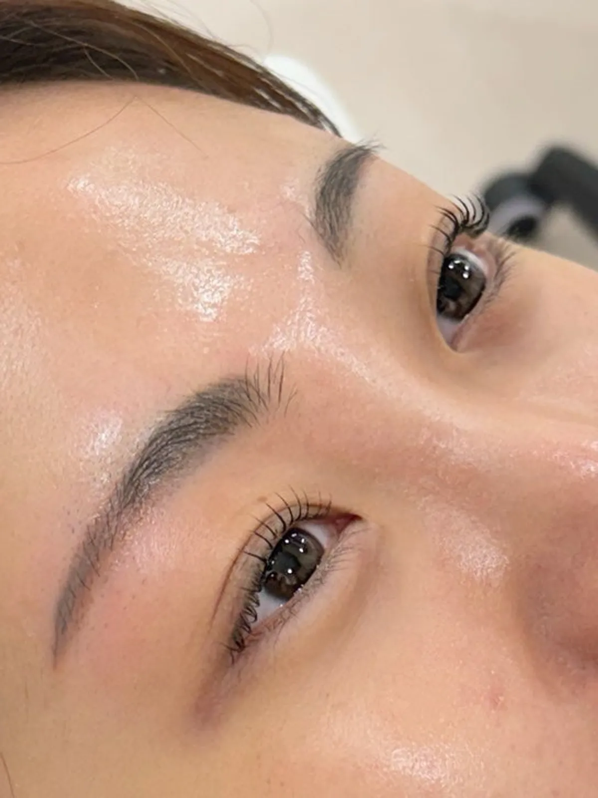 Vertical photo of the before-and-after lash lift result