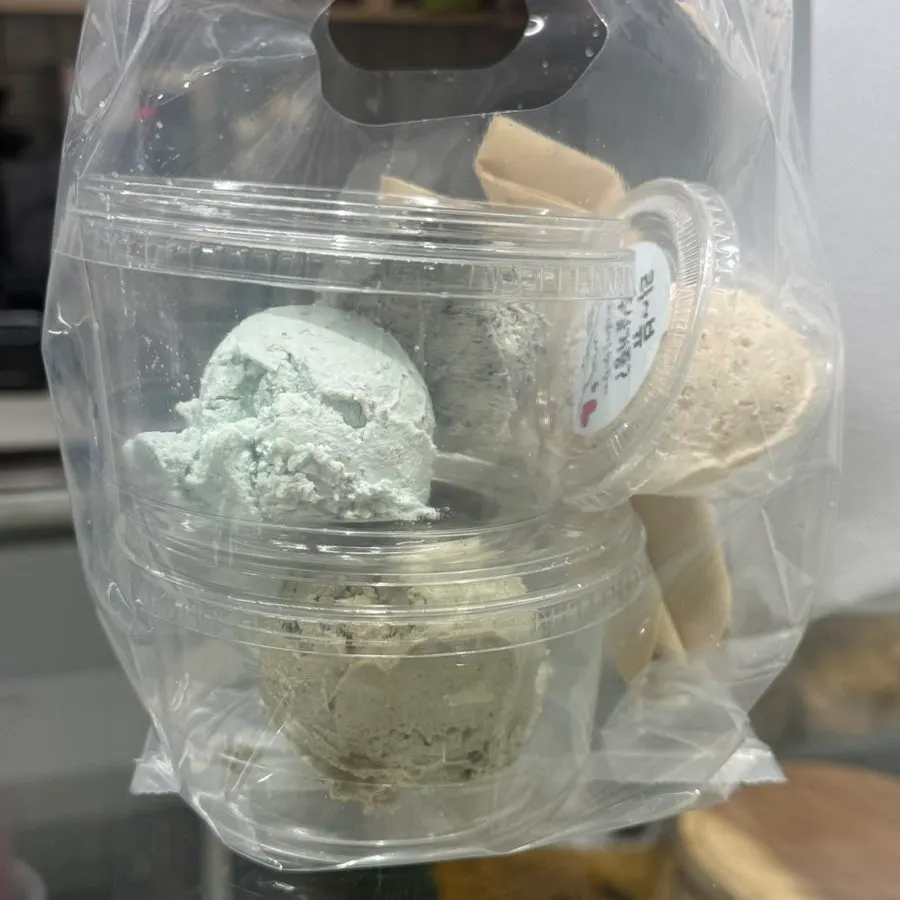 Takeout containers with paper spoons packed neatly