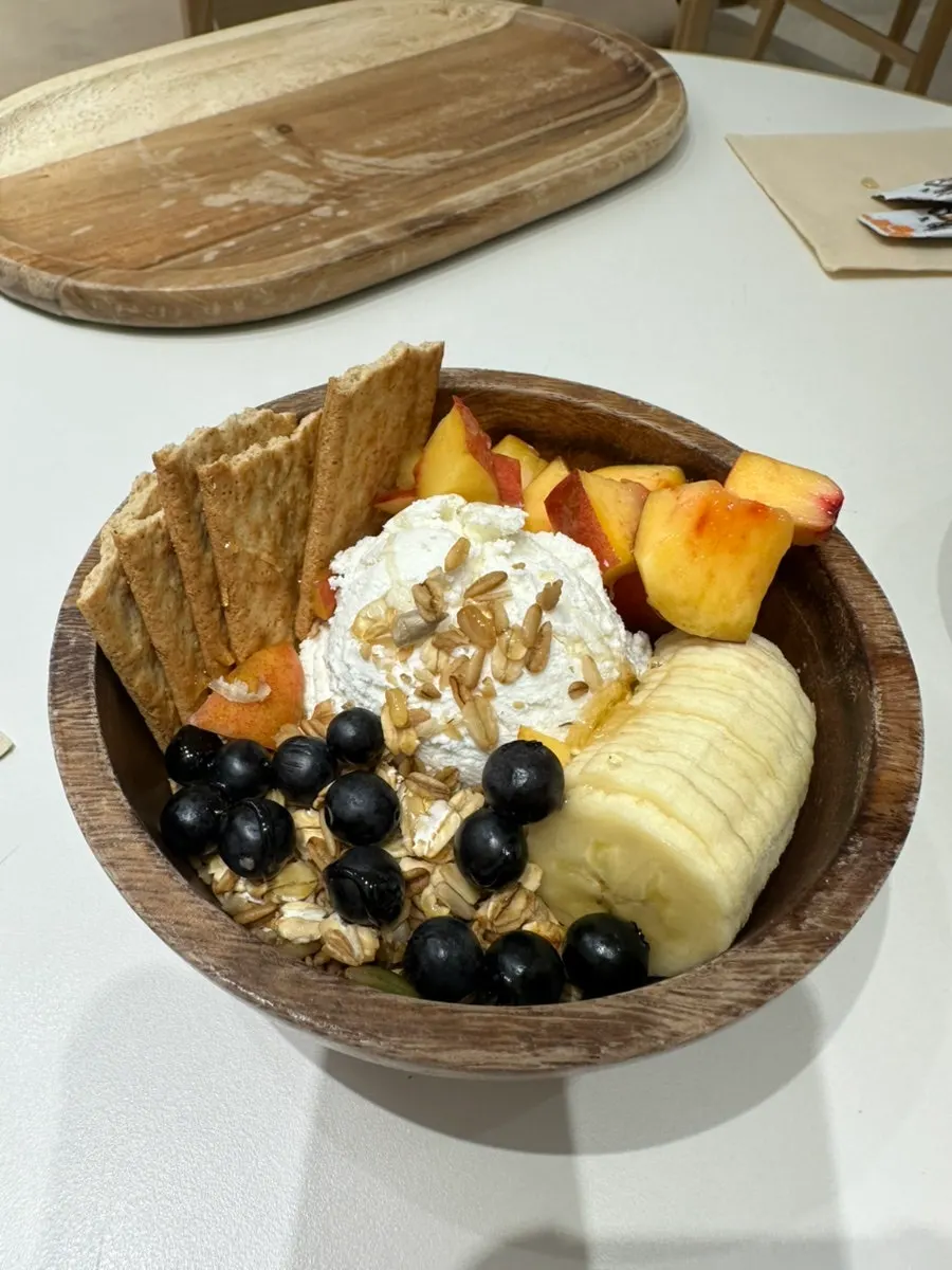 Close-up of yogurt bowl with fruit and granola toppings