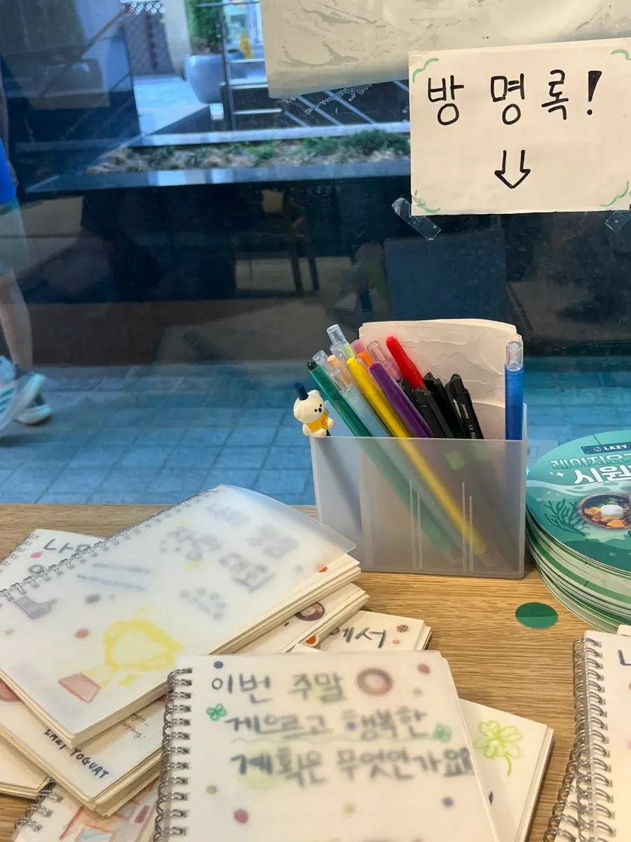 Guestbook notebook space set up on one side of the store