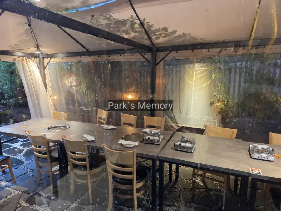 Entrance area of the BBQ restaurant on a rainy day