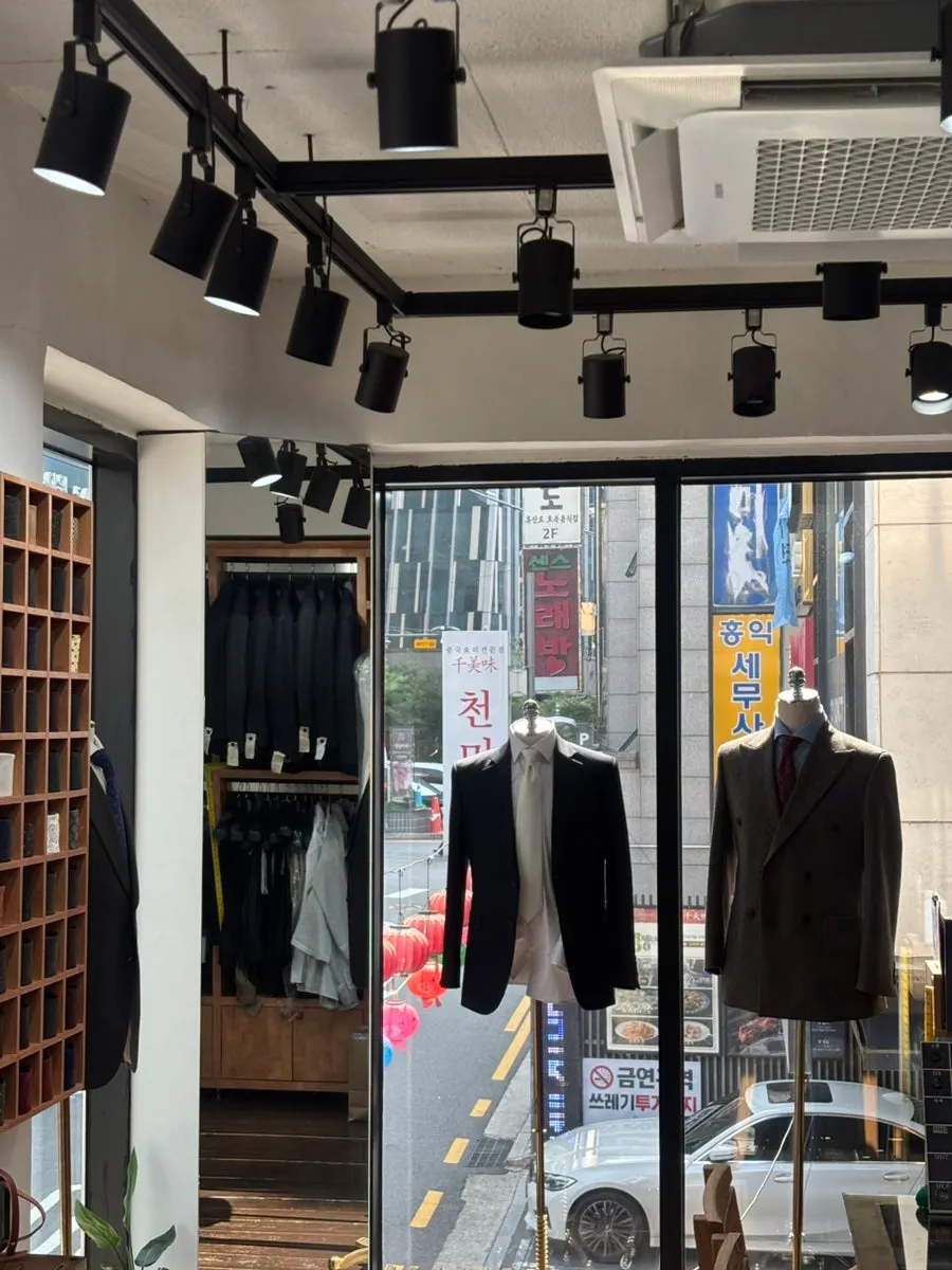 Store interior with consultation table and organized fabric sample books