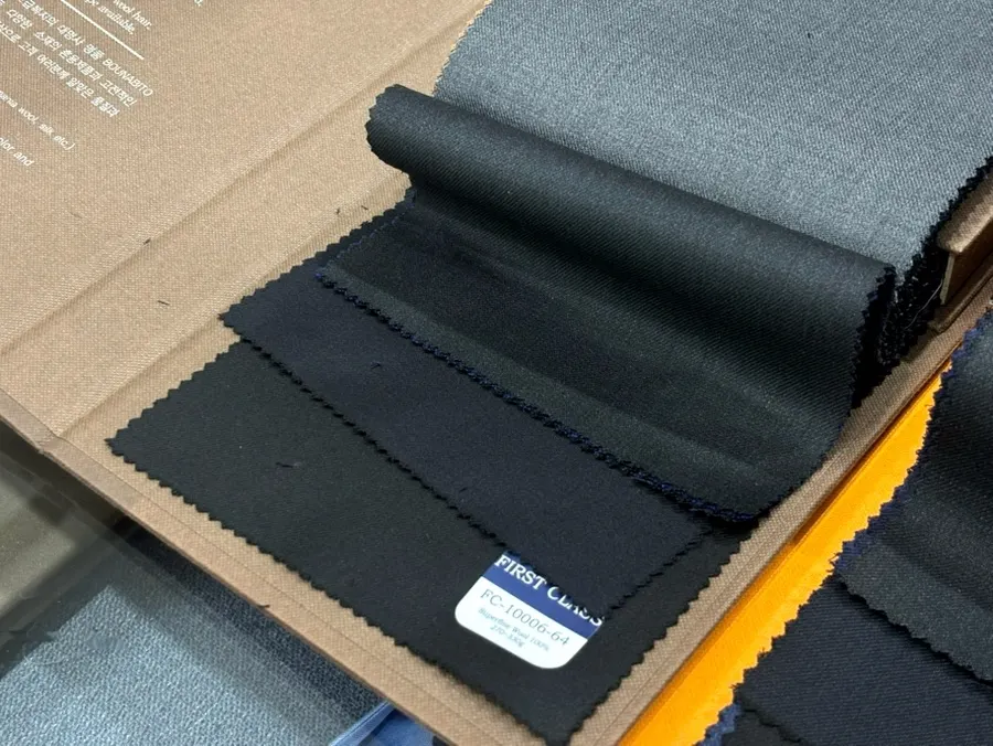 Suit fabric sample books laid out by type