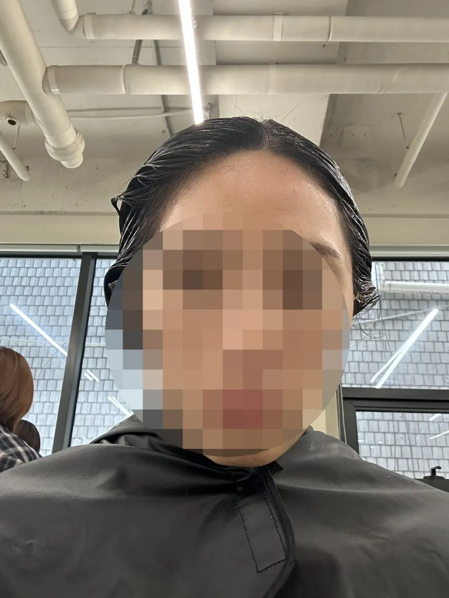 Applying color carefully from root to tip