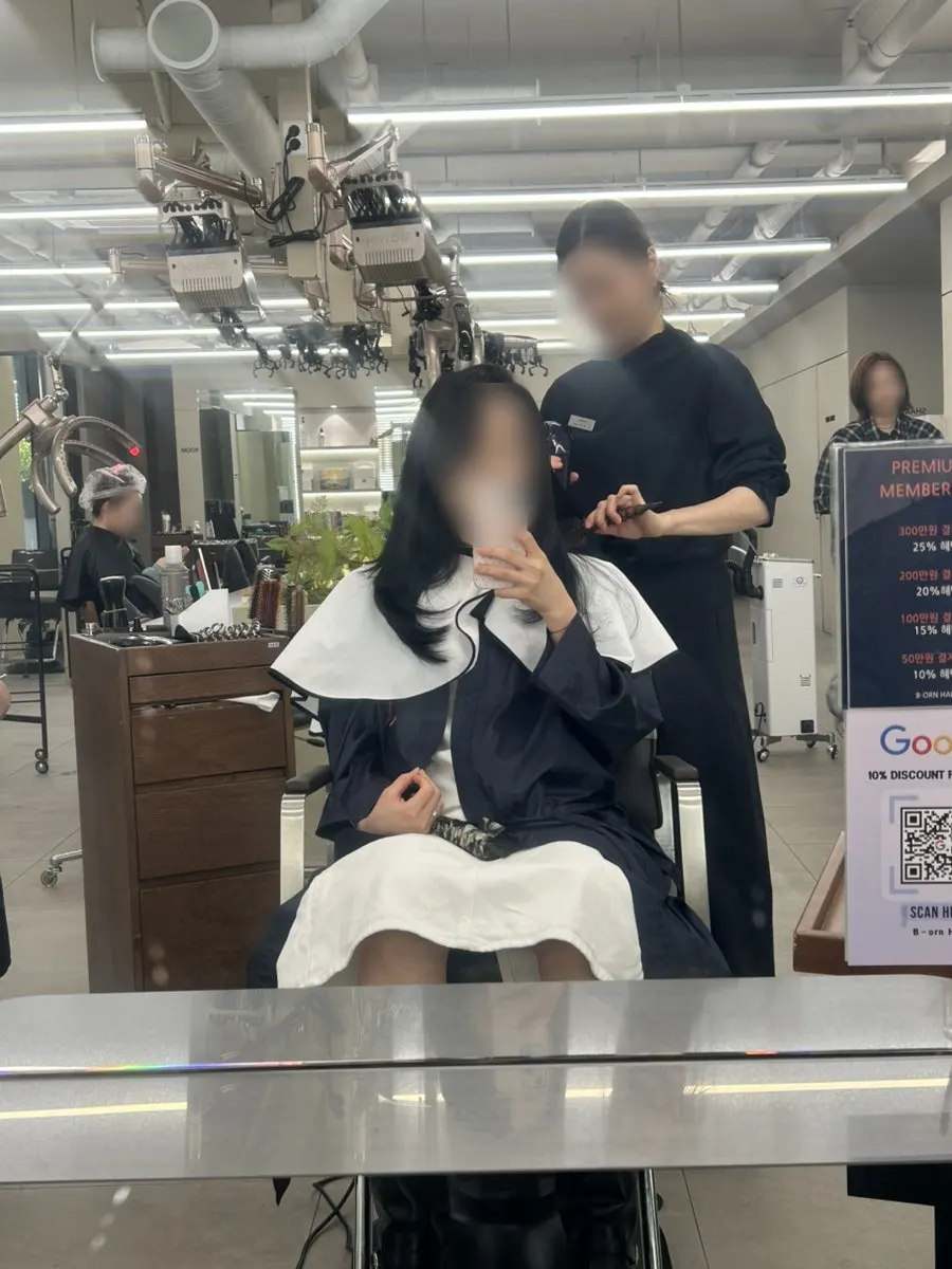 Checking the result in the mirror after coloring
