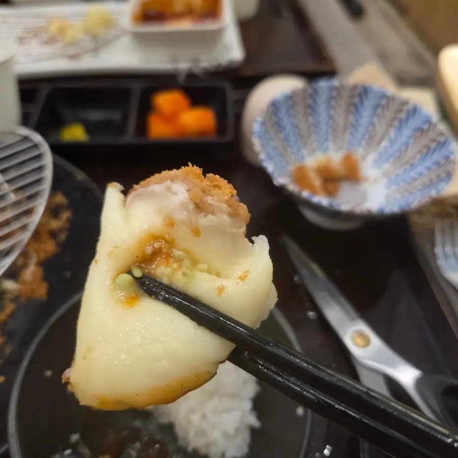 A full table spread of ordered dishes at Cheongdam Kkatsu