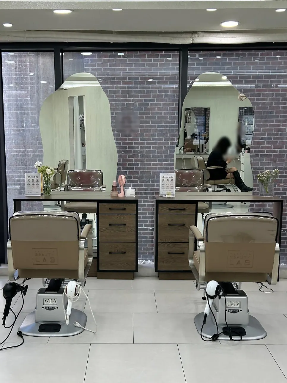 Interior of the hair salon decorated in white tones