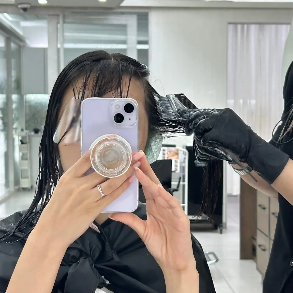 Perm rods being wound during the C-curl perm process