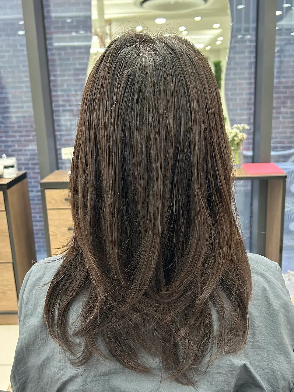 Back view of the finished mid-length C-curl perm