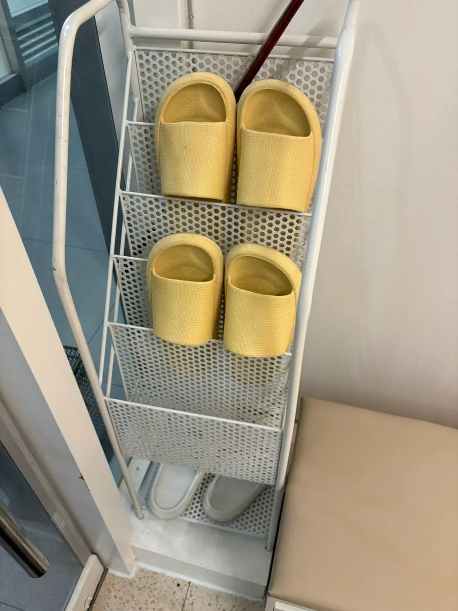 Waiting area near the entrance where guests change into slippers