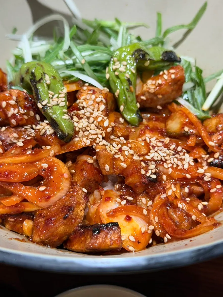 Gochujang pork rice bowl with char-grilled pork mixed in