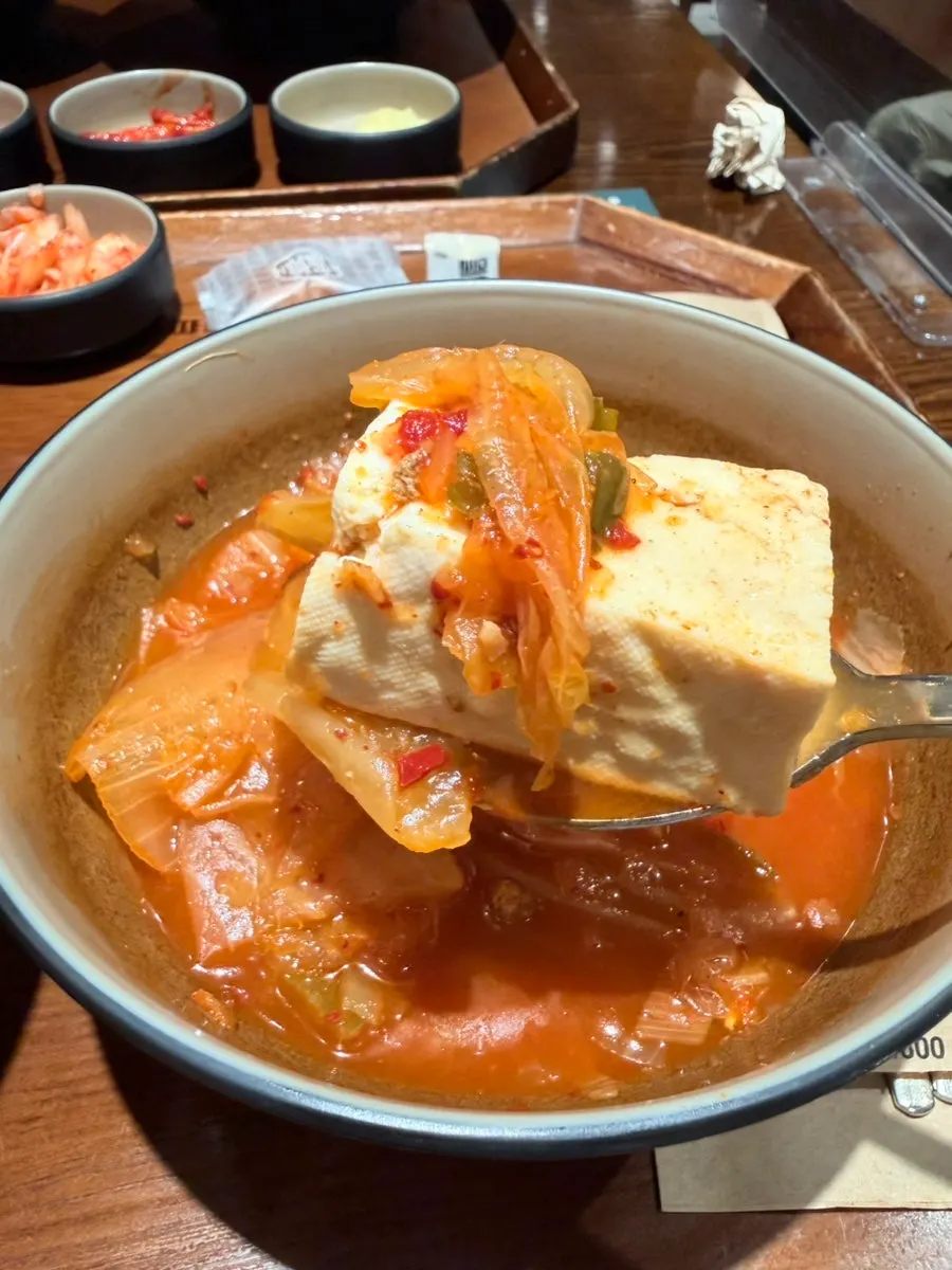 Kimchi jjigae served alongside the Jeonju bibimbap
