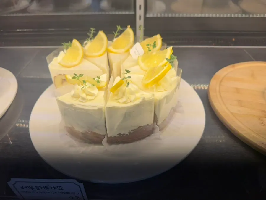 Various cakes topped with fruit