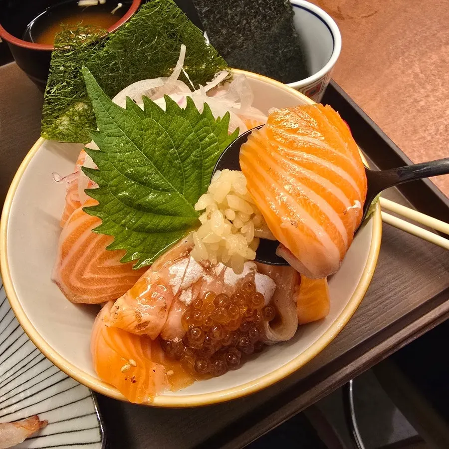 Close-up of sake-don with wasabi and pickled ginger